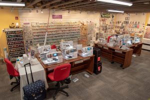 room with a collection of thread and sewing equipment