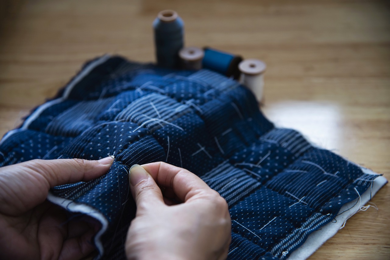 A photo of a woman's hands while sewing