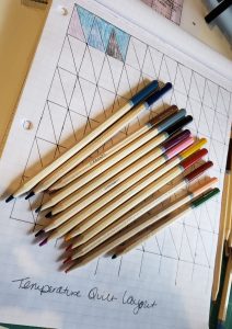 a collection of colored pencils