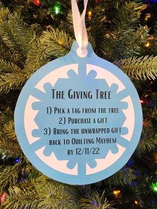 Giving Tree gift tag with instructions on how to give to Quilting Mayhem's toy drive for Toys for Tots.
